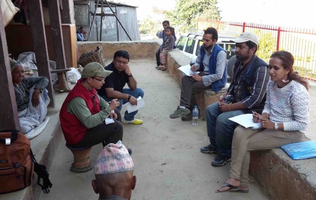 An Amity Foundation staff member conducting a needs assessment (photo by Jock Baker)