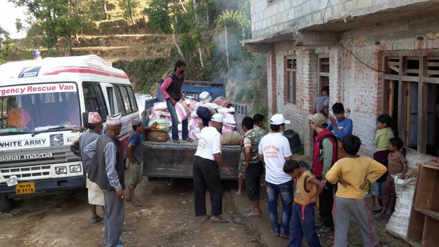 The Indian NGO “White Army” off-loading food aid.  Similar to the Chinese NGOs, this was their first experience working outside of their own country (photo by Jock Baker)