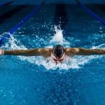 Professional swimmer uses fame to help underprivileged